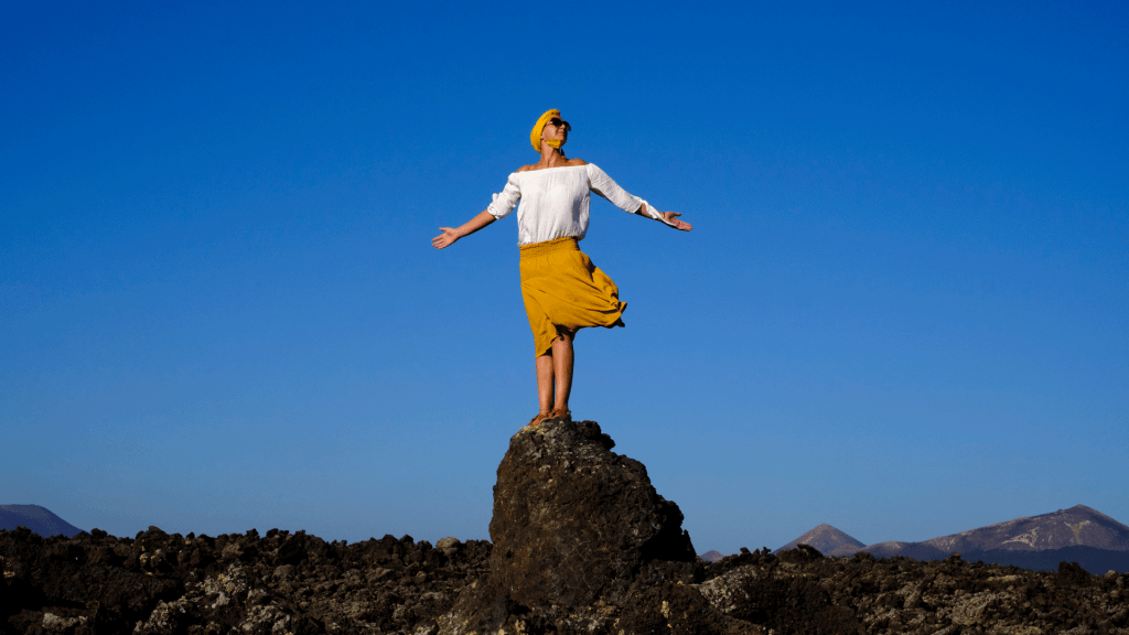 Emma standing on rocks
