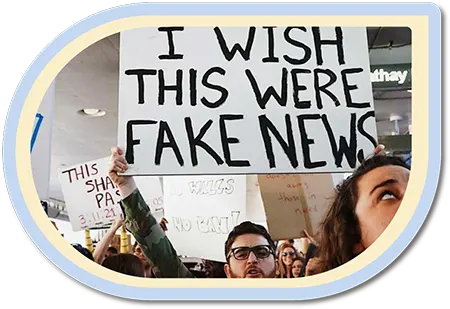 Holding up fake news sign