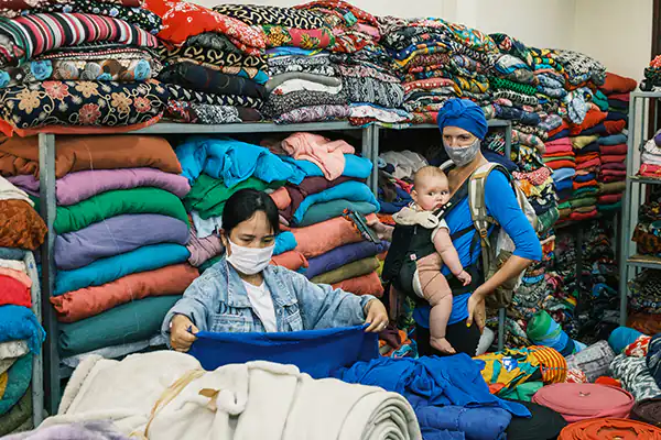 Two women shopping for material